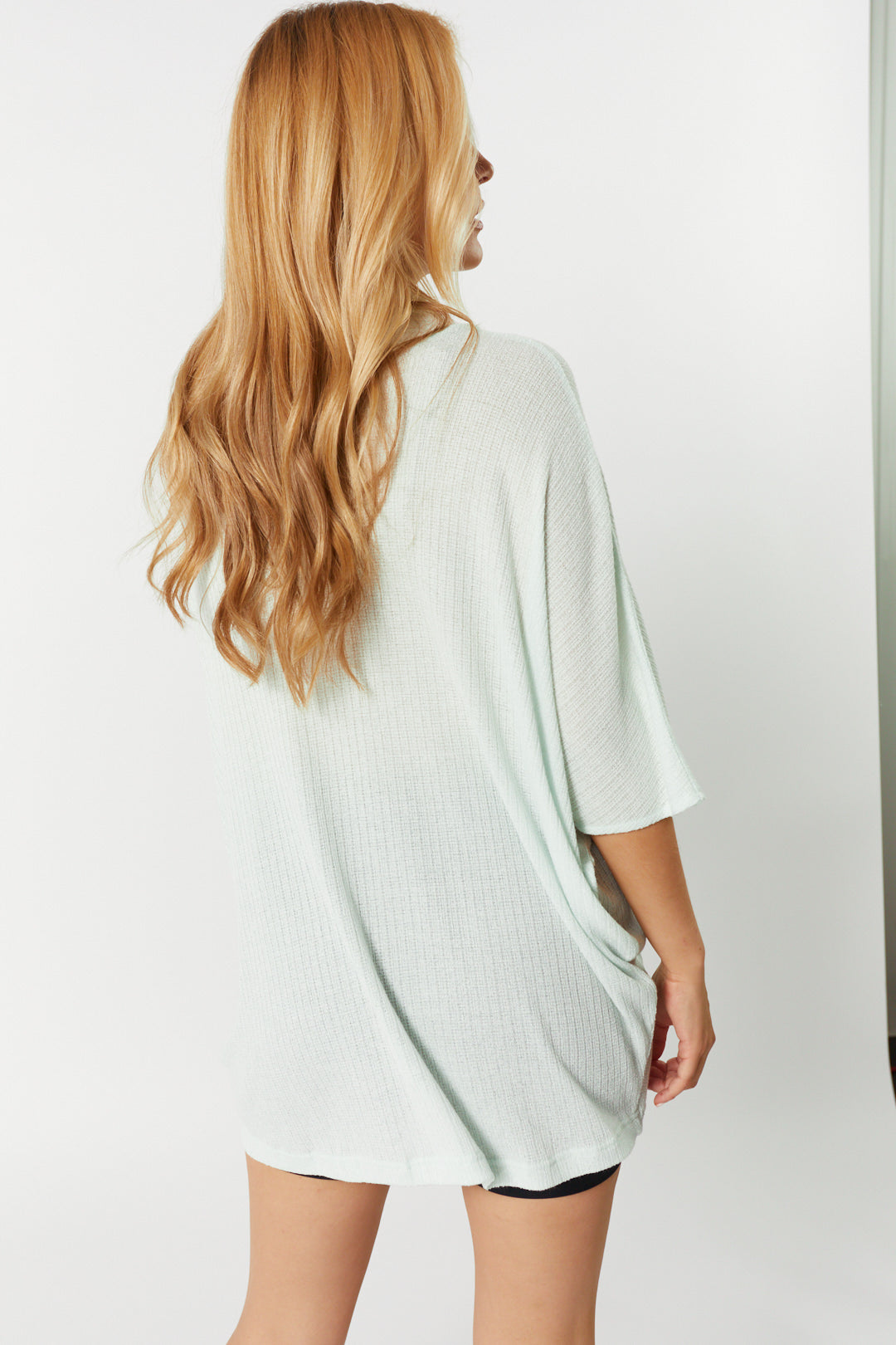 Loose pale green sweater | Delevingne