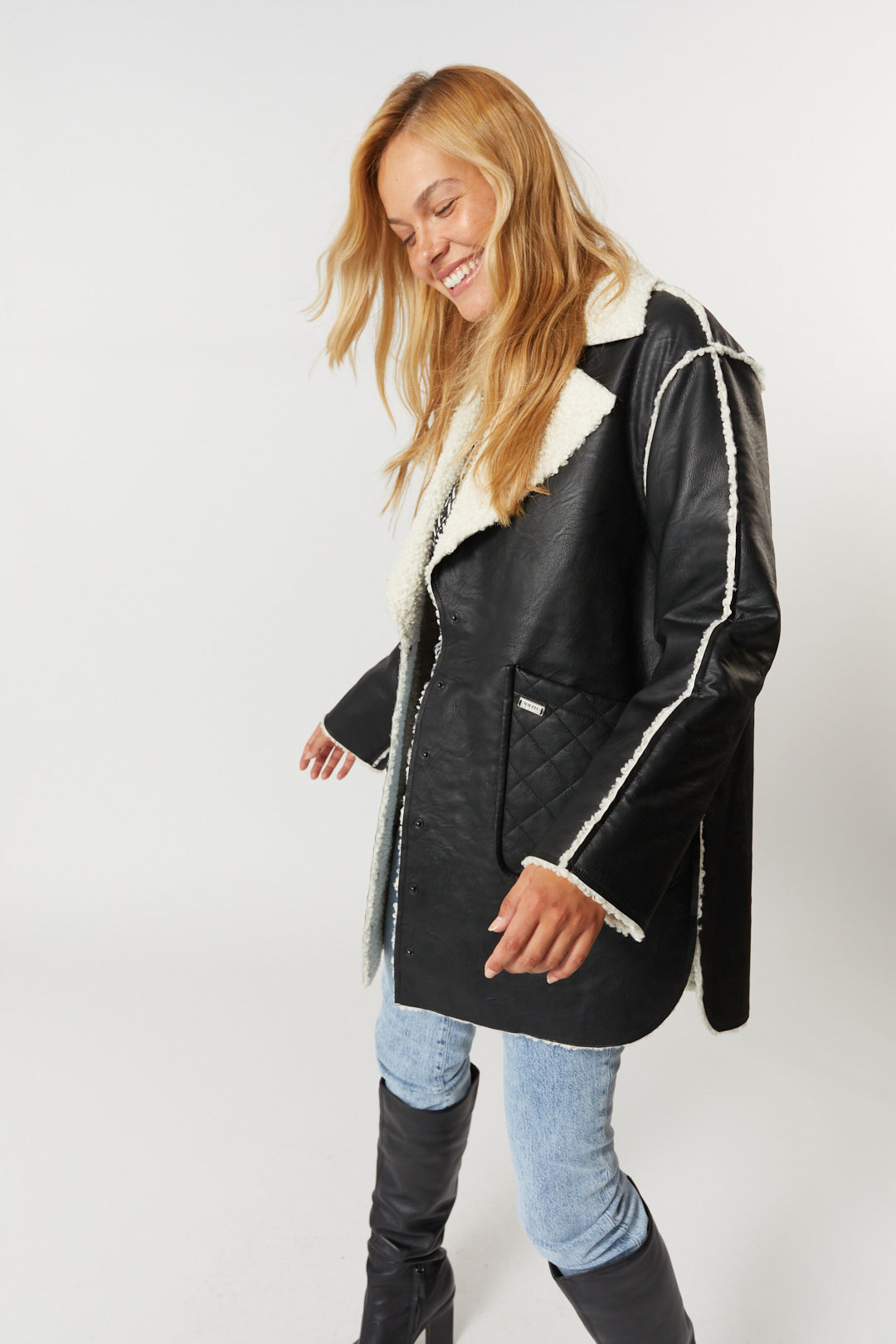 Black faux leather and sheepskin effect coat | Rebecca