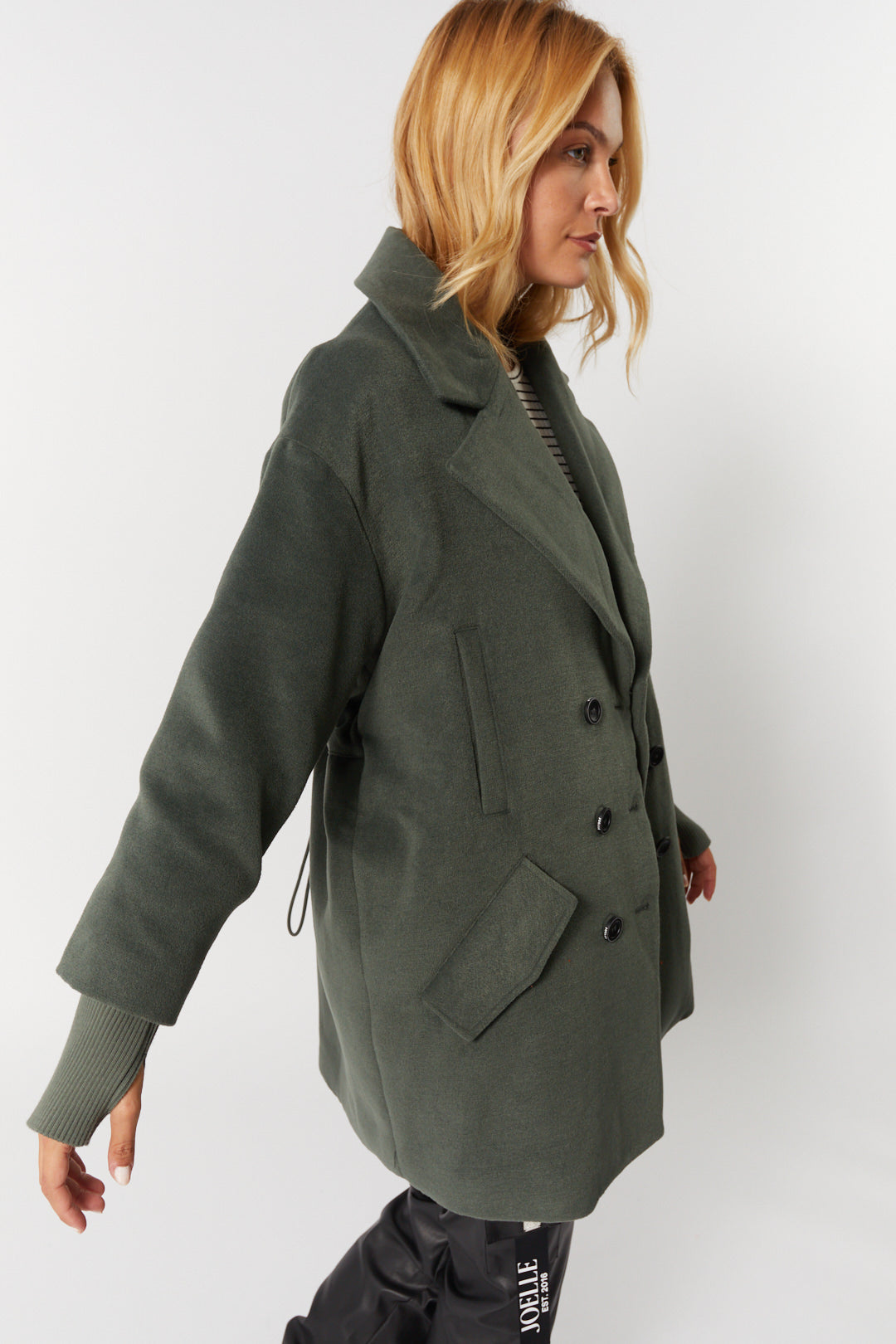 Sage green coat fitted at the back | Gwen