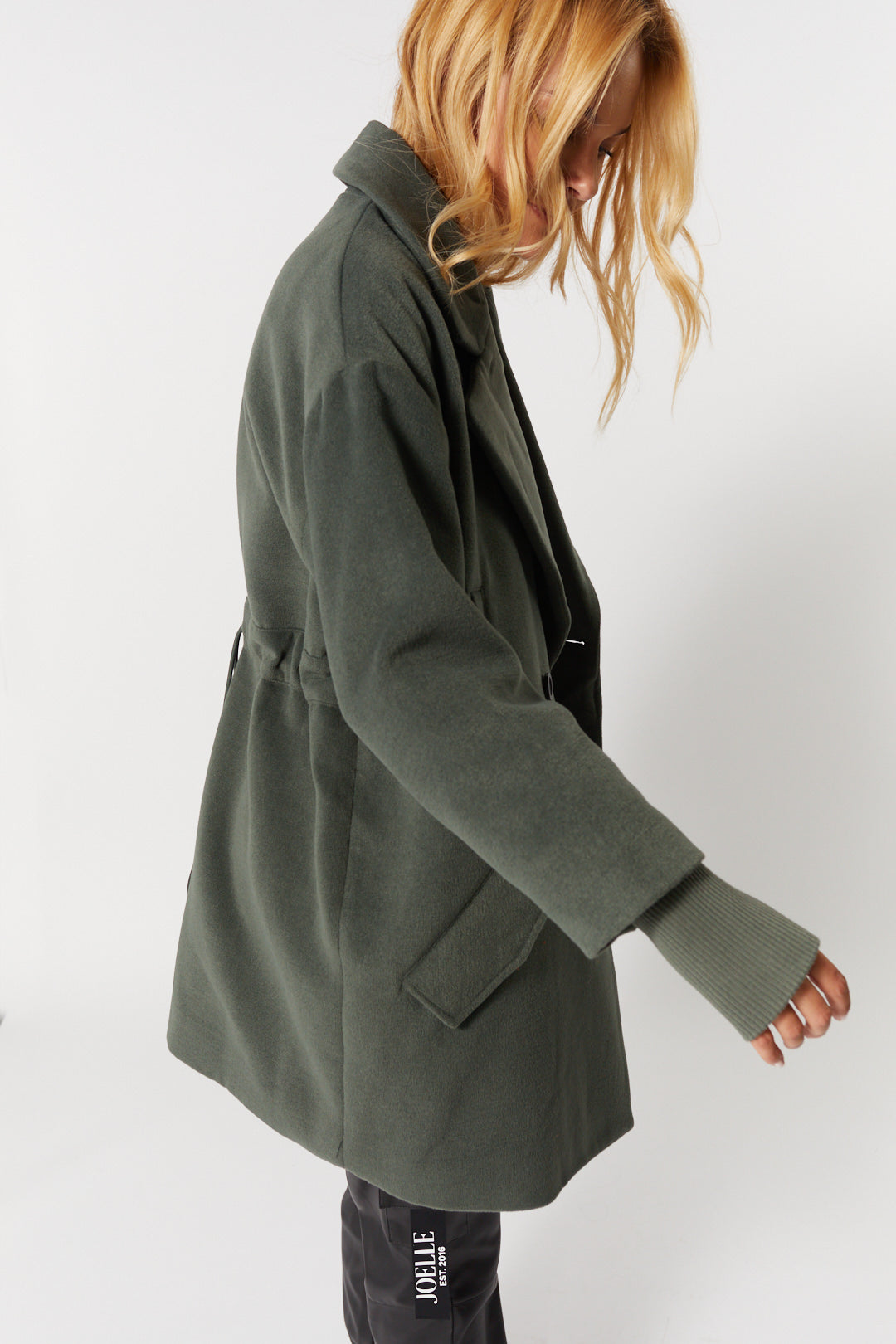 Sage green coat fitted at the back | Gwen