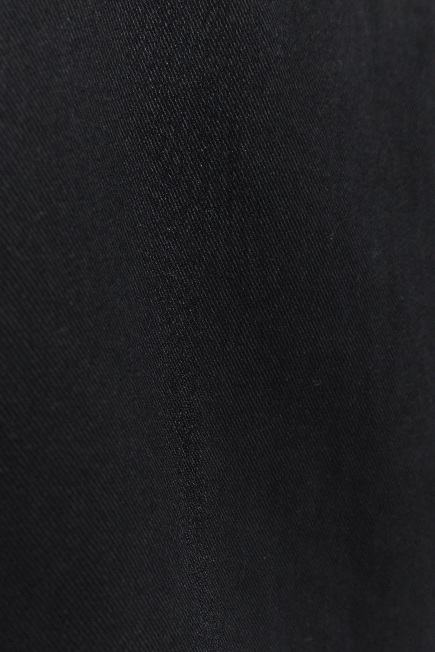 Gigi | La veste noire asymétrique sans manches